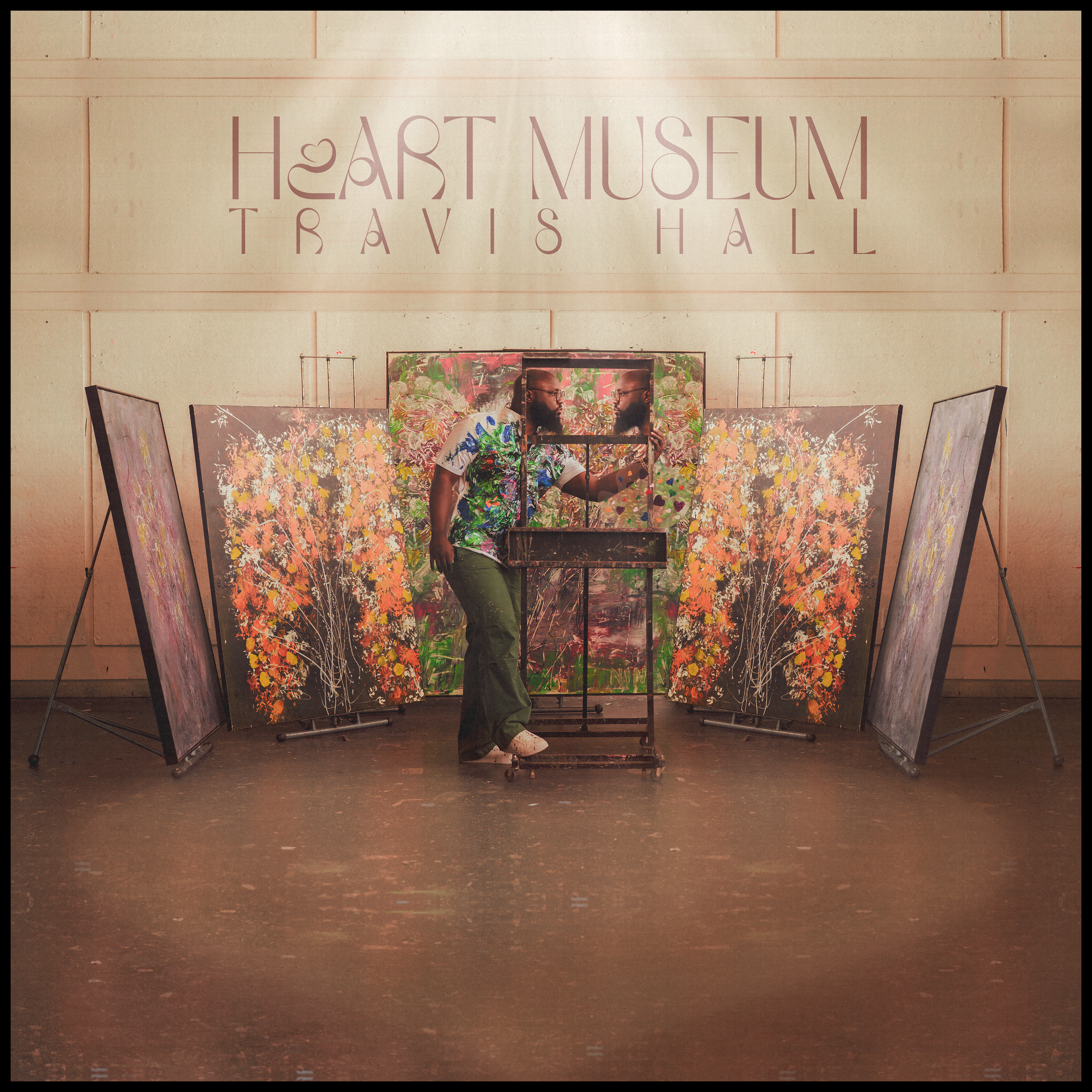 HeART Museum album cover — Travis Hall among floral abstract canvases, holding a mirrored frame.